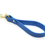 third anniversary gift wrist loop keychain in matisse blue with gold hardware.