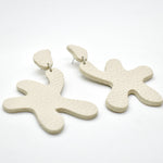 bone white leather cutout dangling star earrings with surgical steel posts