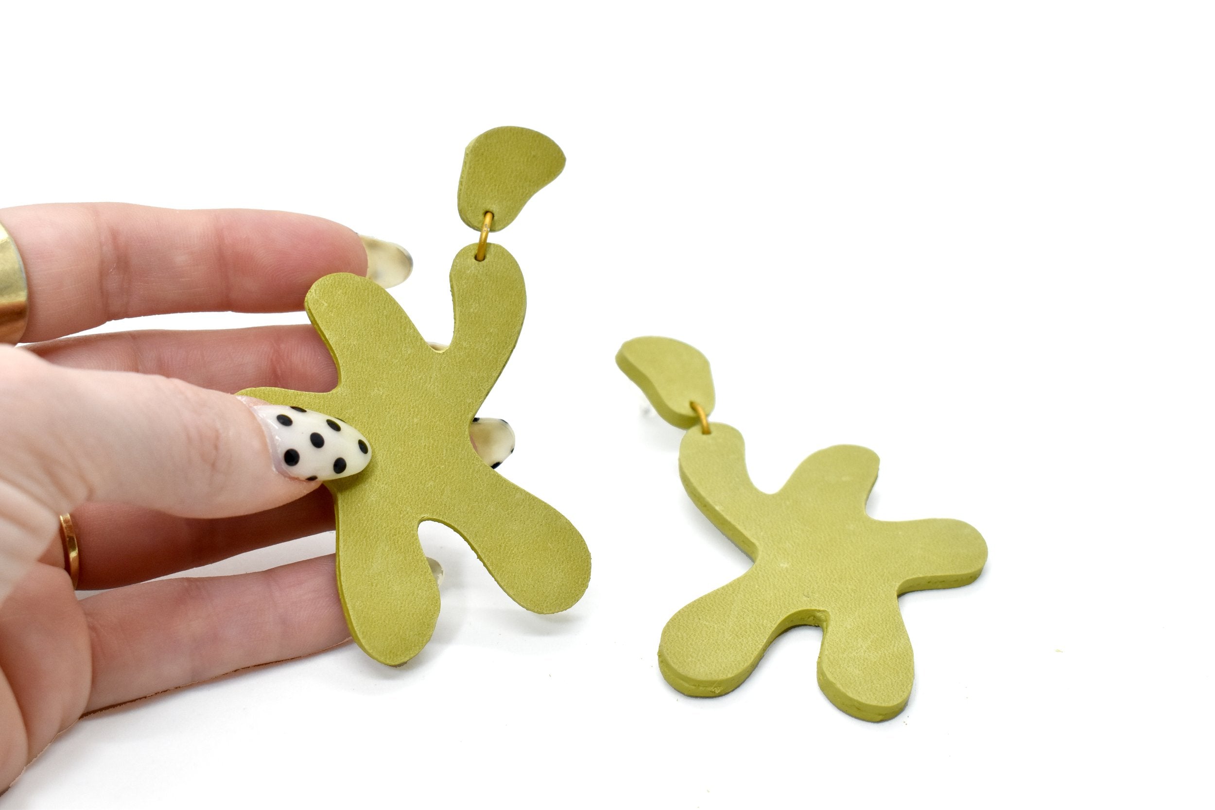 cutout star earrings in chartreuse textured leather