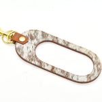 chestnut speckle hair on hide side dual color keyhole cutout leather keychain in chestnut and hair-on-hide