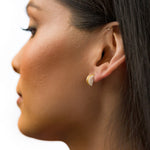 model wearing crystal quartz studio stud earrings birthstone present gemstone jewelry gold architectural earrings modern minimal earrings
