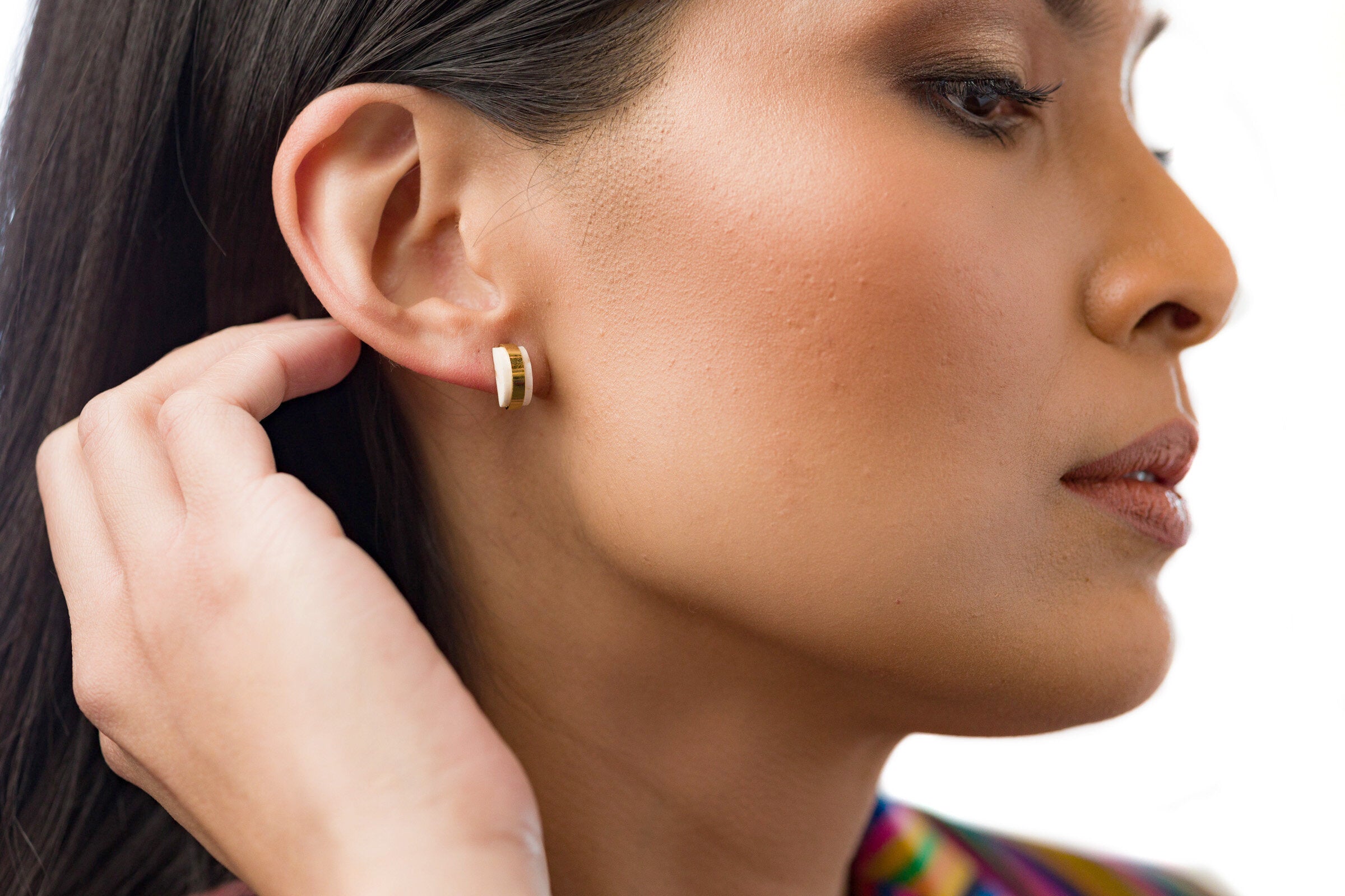 model wearing crystal quartz studio stud earring birth stone gift for her gemstone earrings gold geometric studs