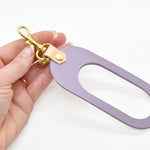 dual-colored leather cut out key chain hand strap with gold keyring and spring clasp in lavender and beige natural authentic leather