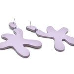 abstract statement earrings cut out leather in lavender finish.