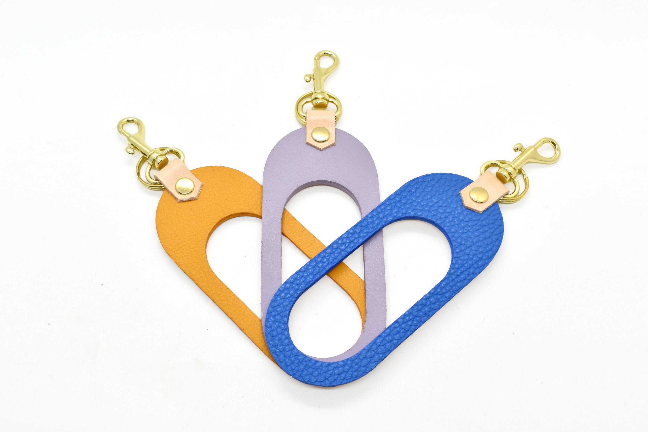marigold lavender matisse blue leather cut out keychains with gold hardware keyring and veg tan leather side
