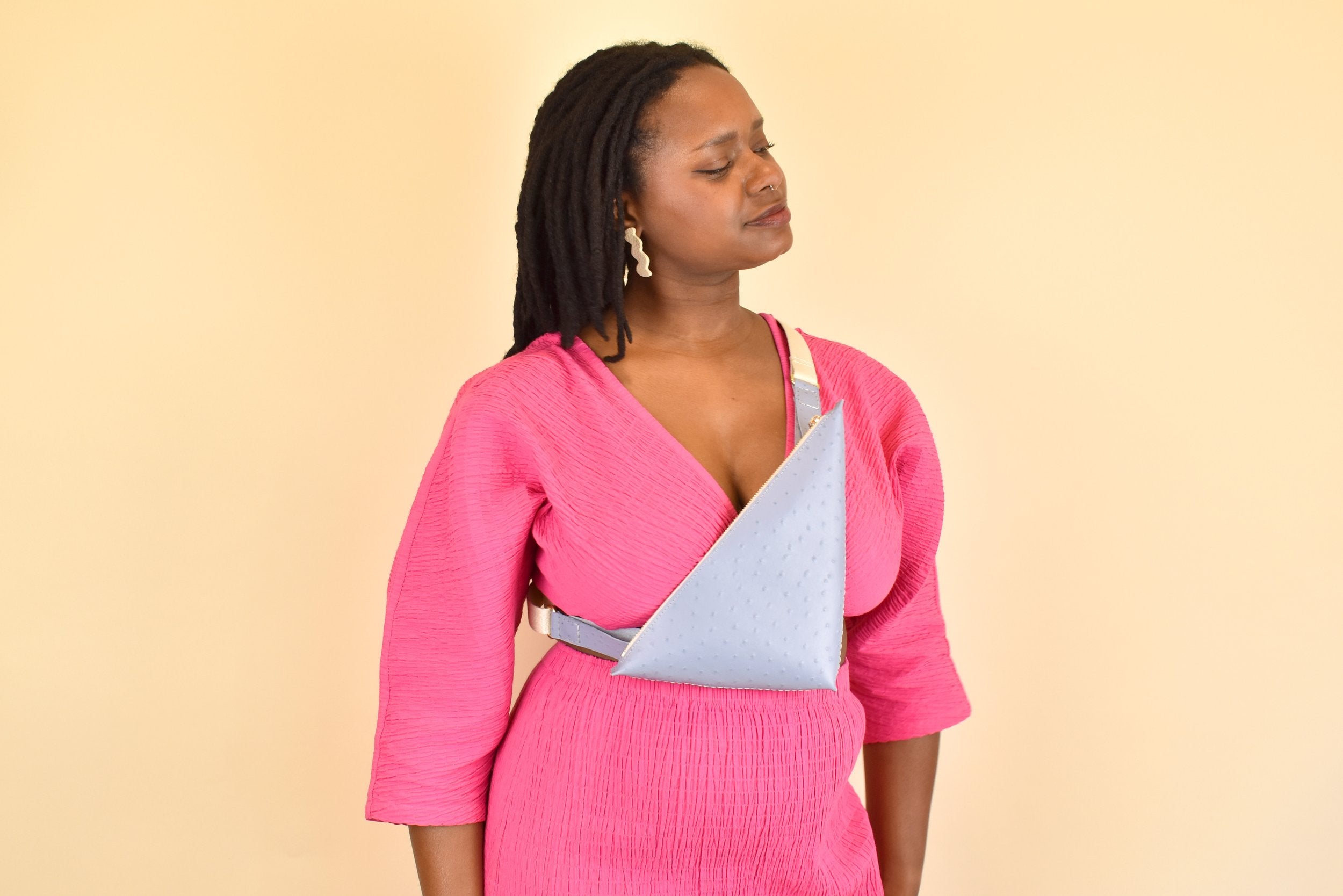Triangle cross body top bag