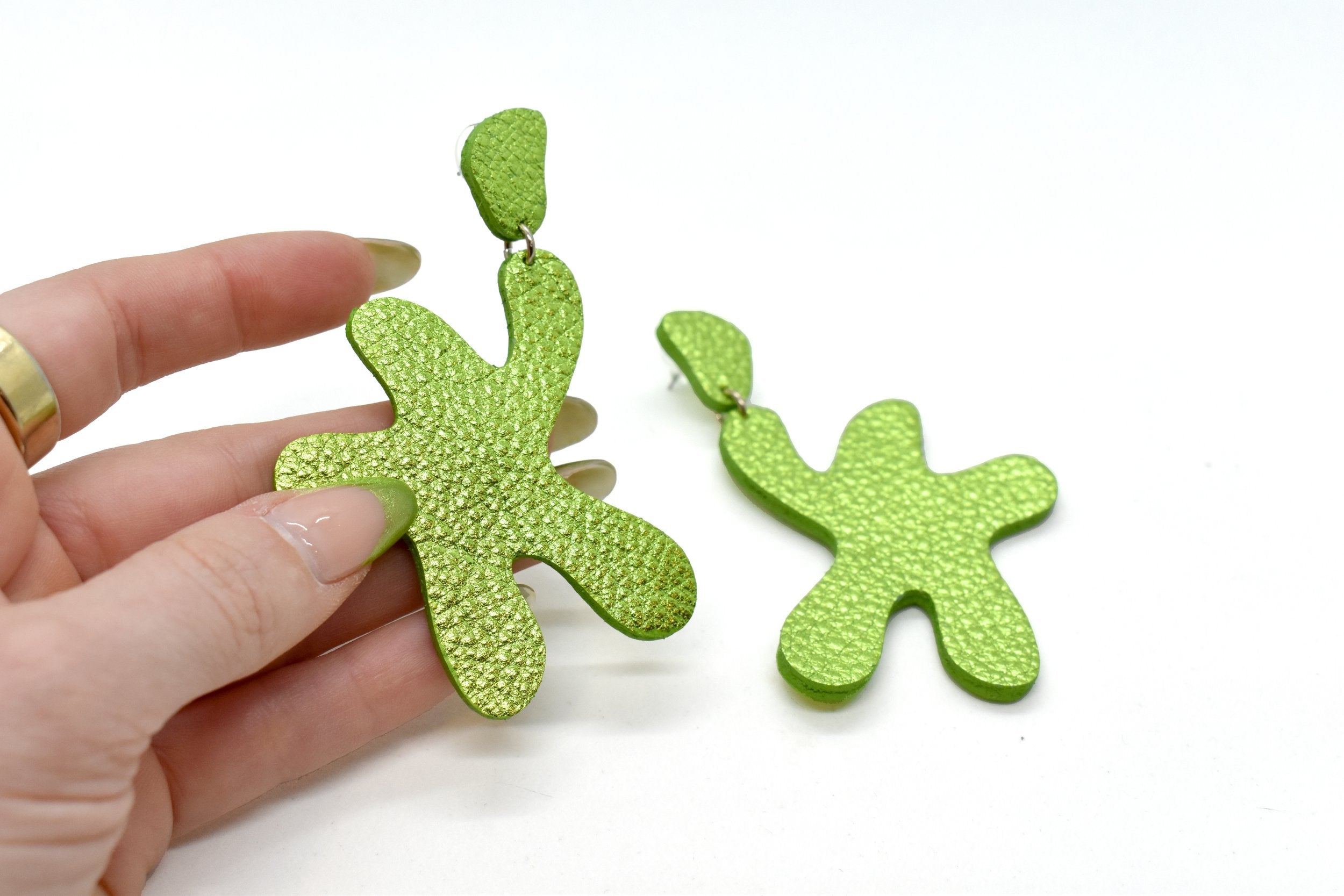 Hand holding Metallic Lime Leather Statement Earrings, Matisse Style Earrings in Lime Green