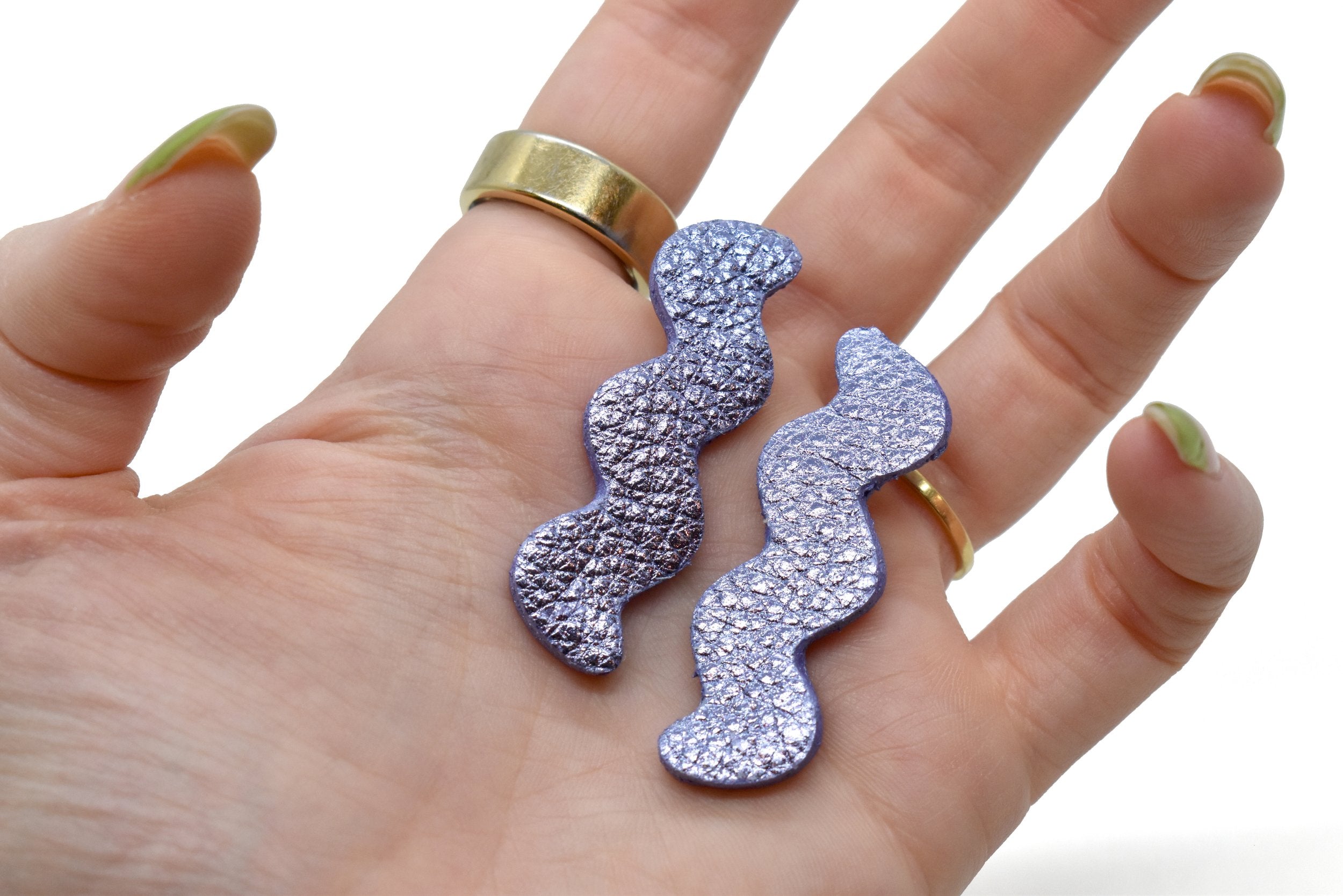 hand holding Metallic Purple Zigzag Statement Earrings, Leather Matisse Earrings in Metallic Purple