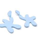 sky blue leather earrings made of cutout organic shapes and anodized aluminum jump rings.