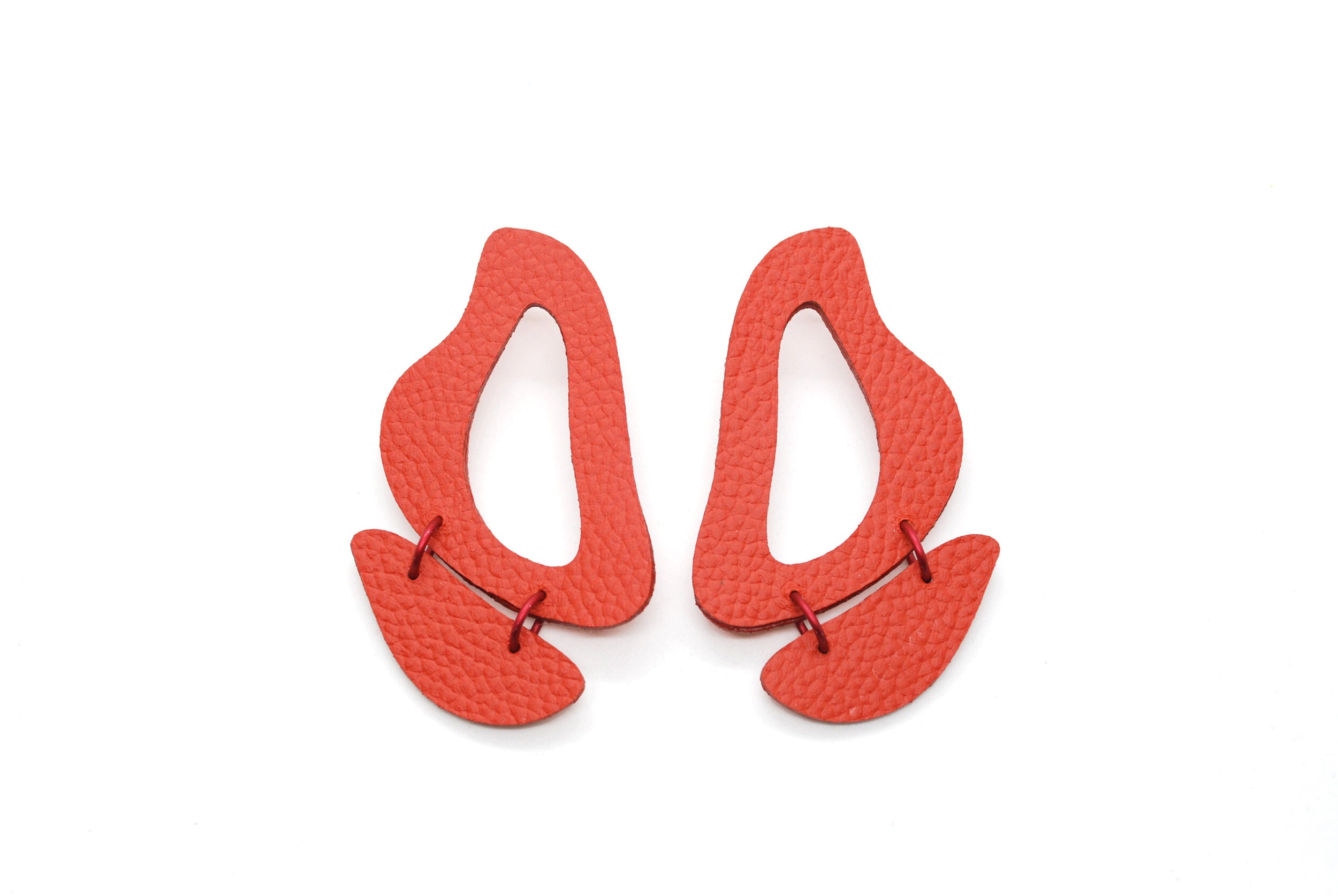 Red Leather Earrings made of Cutout Organic Shapes and Anodized Aluminum Jump Rings.