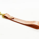 metallic rose gold leather wristlet loop keychain with gold details