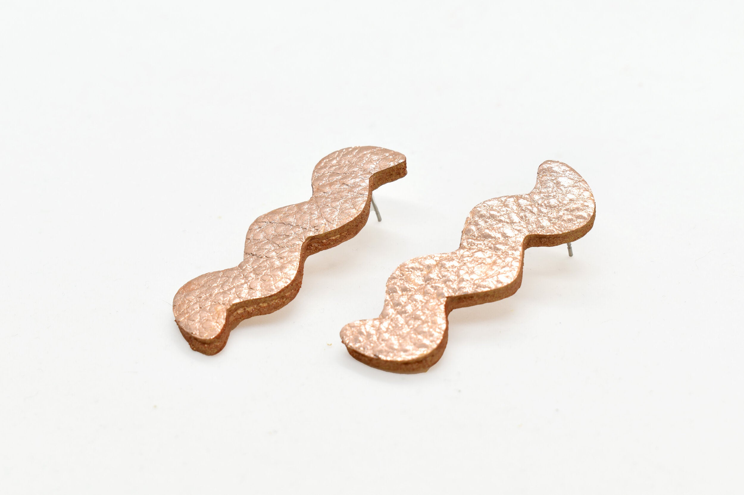 leather lightning strike cutout matisse earrings in metallic rose gold leather