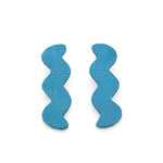 wavelength shape leather statement earrings in deep turquoise.